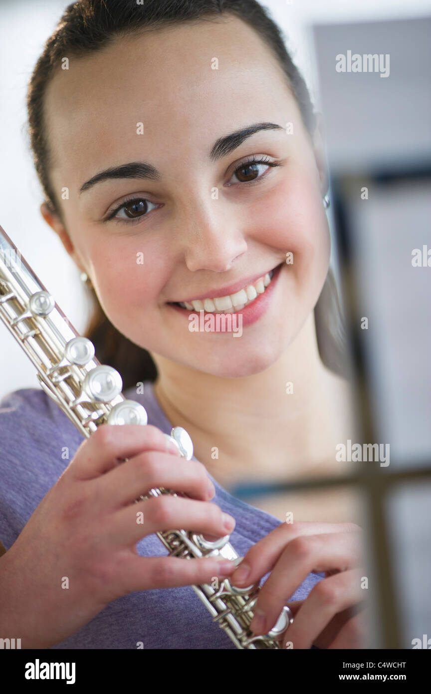 USA, New Jersey, Jersey City, Teenage girl (14-15) posing with flute Stock Photo
