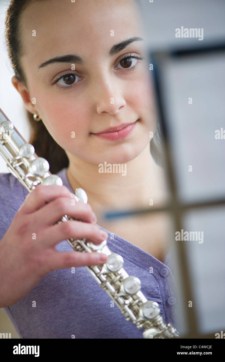 USA,New Jersey,Jersey City,Teenage girl (14-15) holding flute Stock Photo