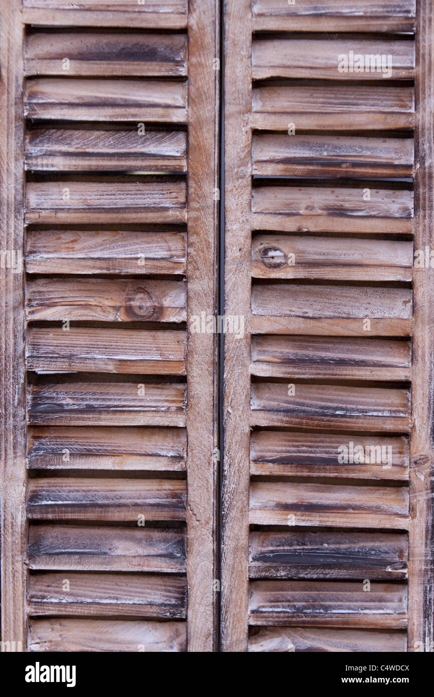 Wooden Decorative Louvre window shutters, England, UK Stock Photo