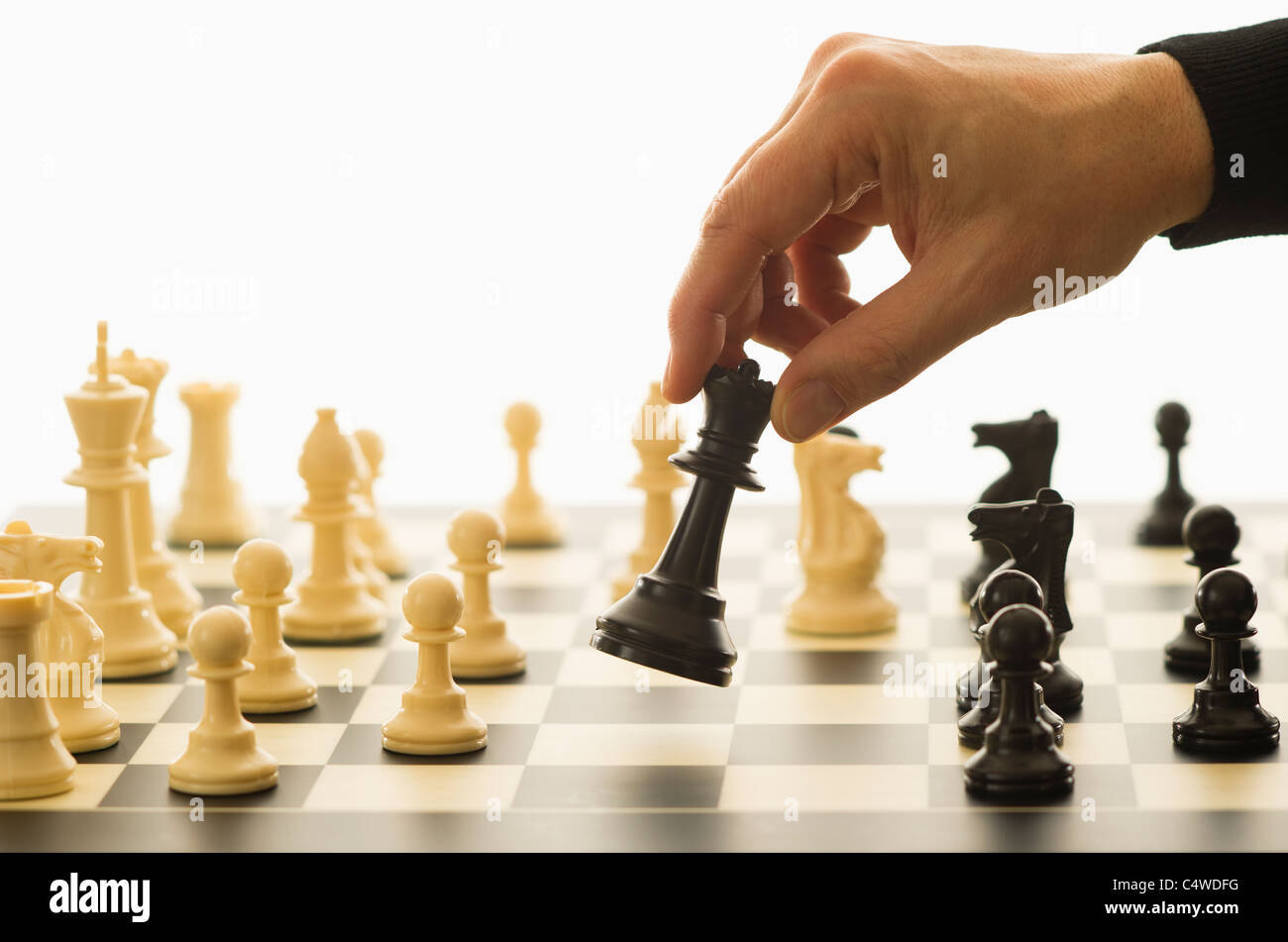 Hand Of A Man Taking A Chess Piece To Make The Next Move In A Chess Game.  Close Up. Spring Day Outside. Stock Photo, Picture and Royalty Free Image.  Image 198493640.