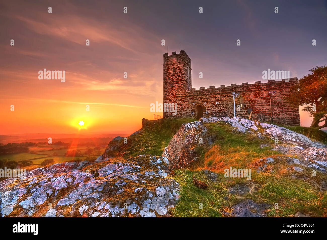 Sunset at Brentor church towering over the countryside. Stock Photo