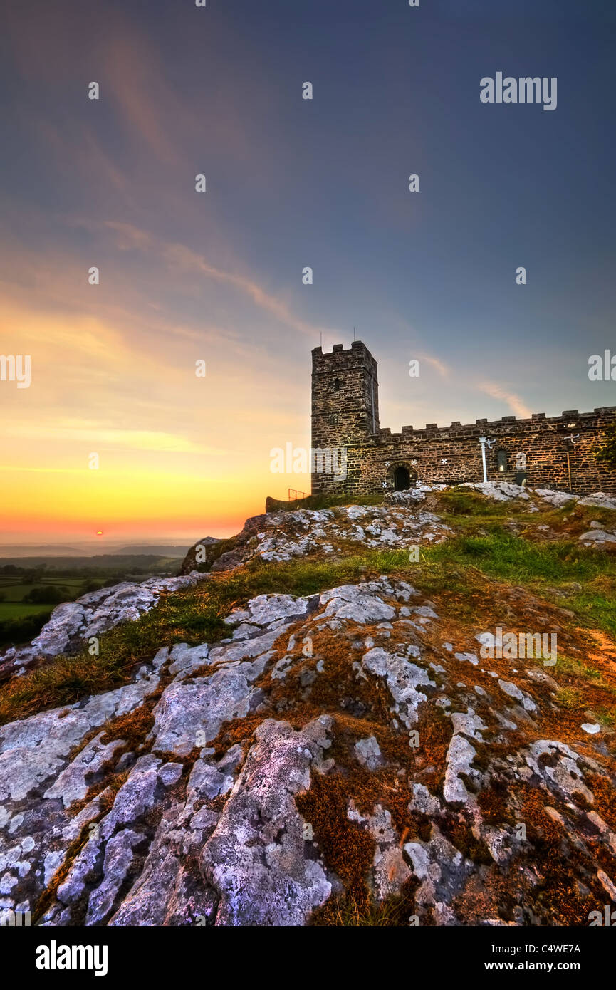 Sunset at Brentor church towering over the countryside. Stock Photo