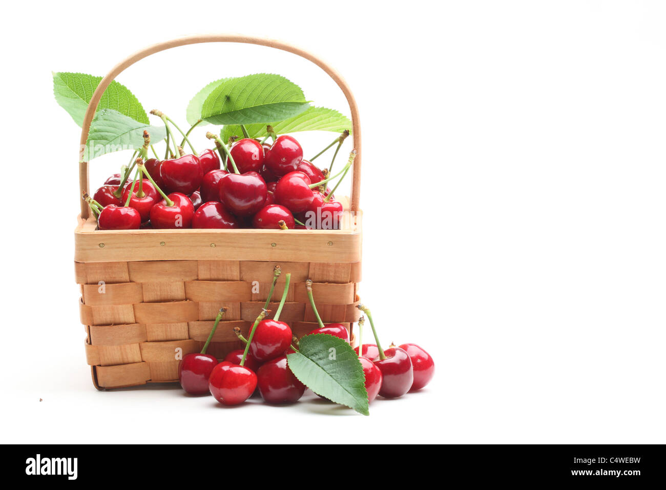 Basket with sweet cherries isolated on white background. Stock Photo