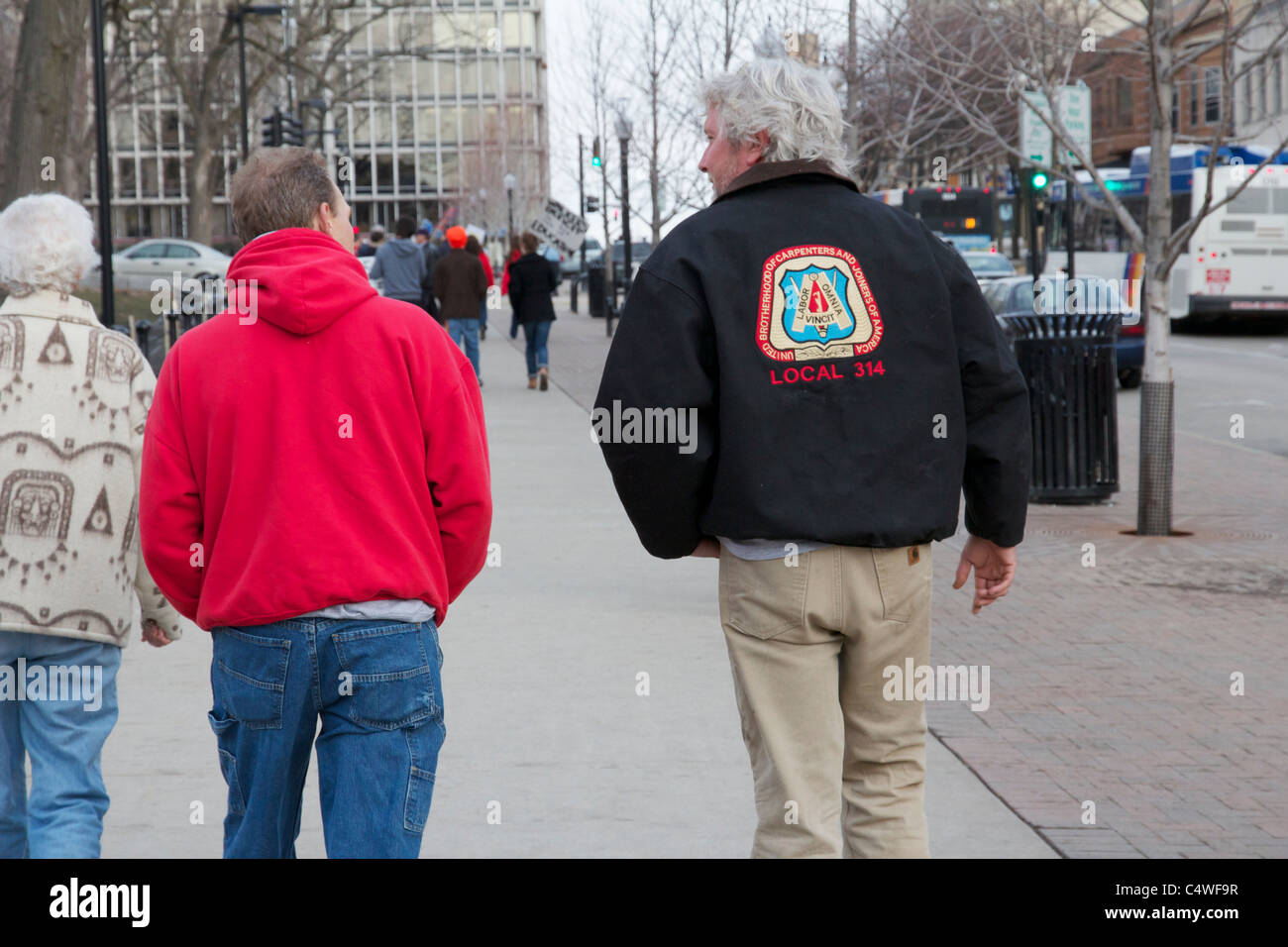 Labor protesters at Wisconsin state capitol. Carpenters' Union member jacket. Stock Photo