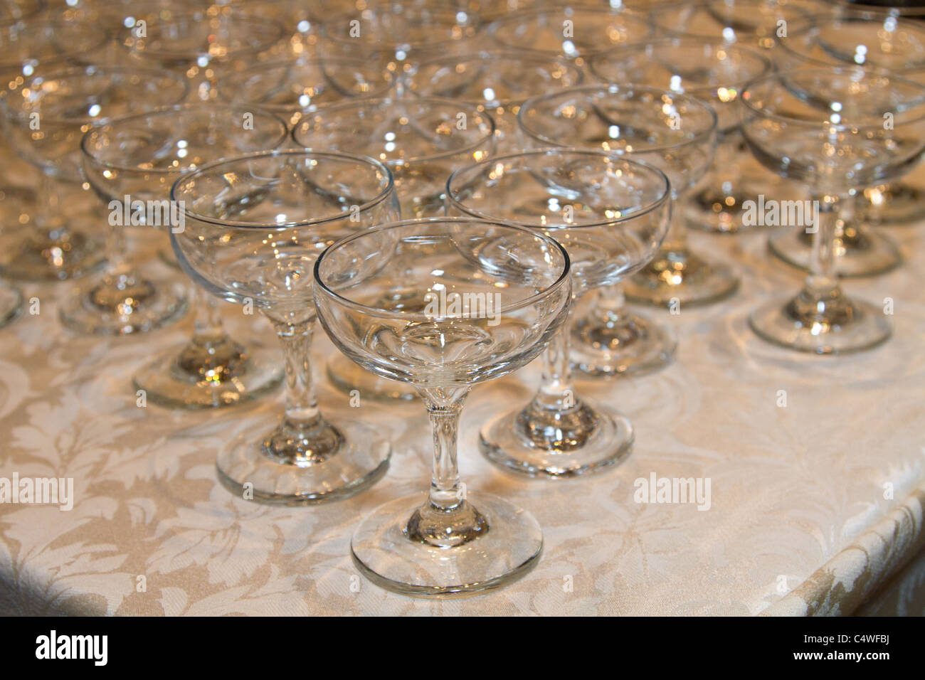 empty wine glasses white table cloth Stock Photo