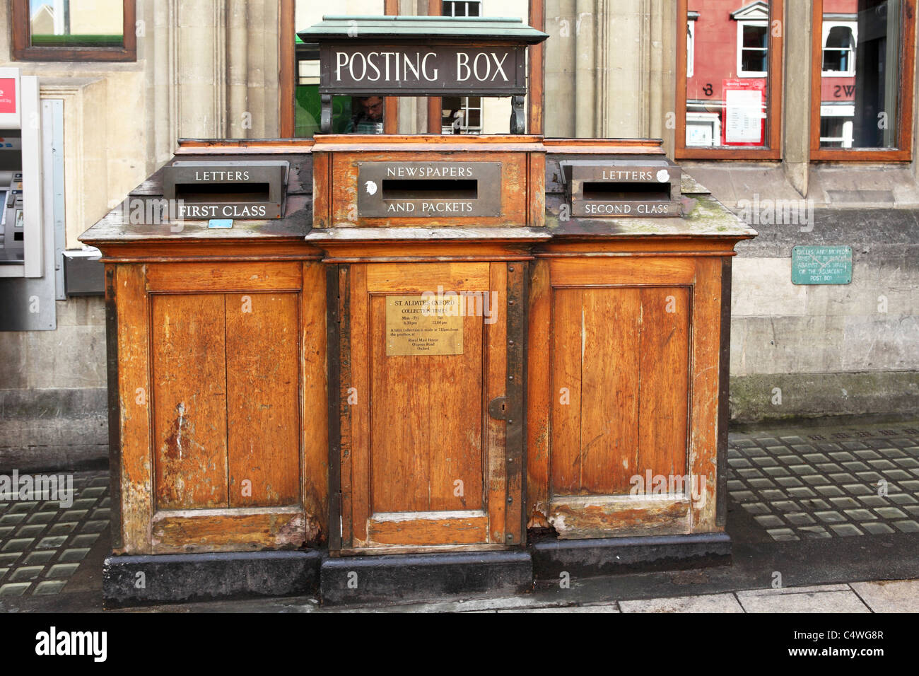 A wooden post box outside of the Post Office in Oxford, England Stock