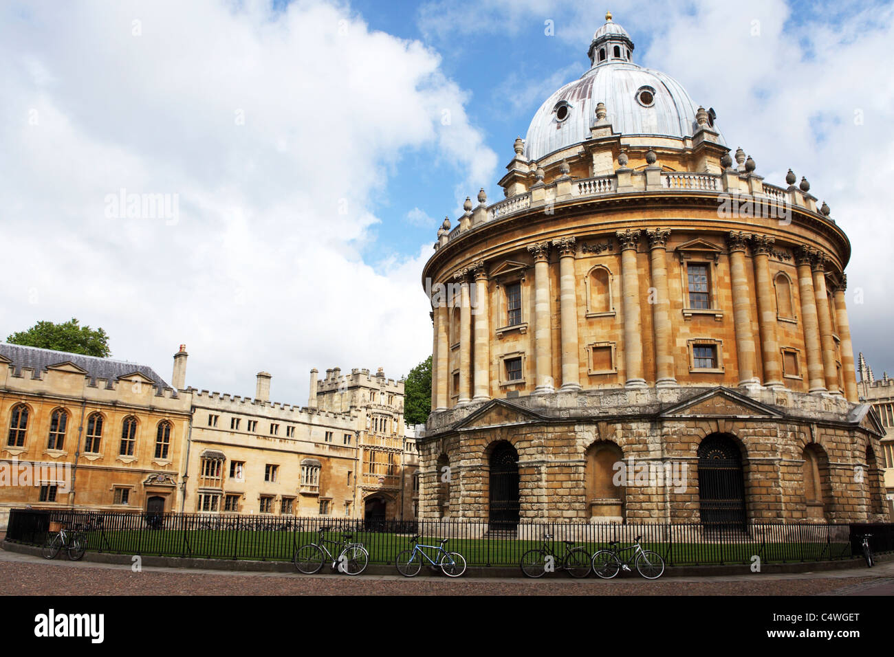 Bicycles are chained to the railings of the Radcliffe Camera on Radcliffe Square in Oxford, England. Stock Photo