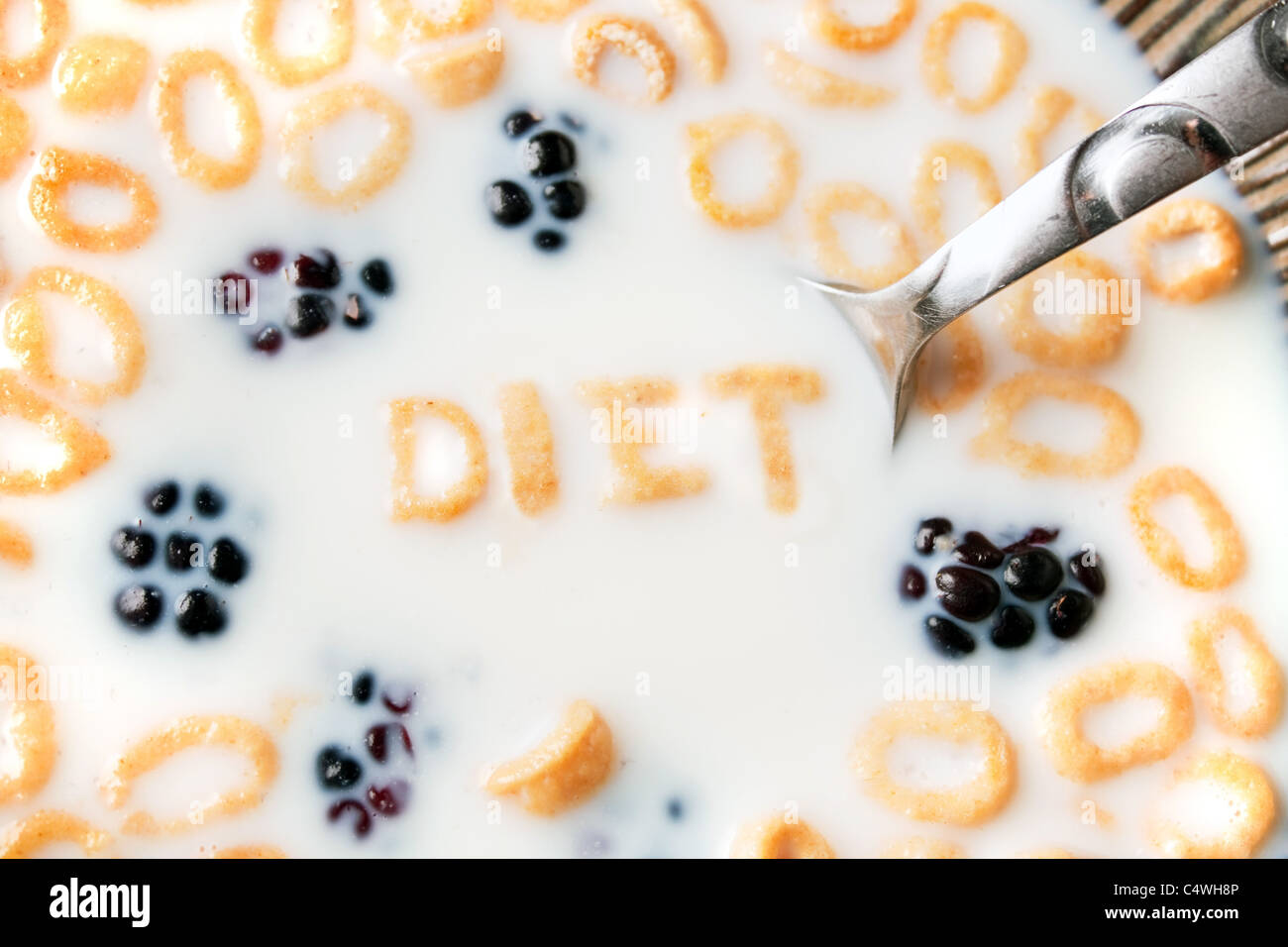 The word DIET spelled out of letter shaped cereal pieces floating in a