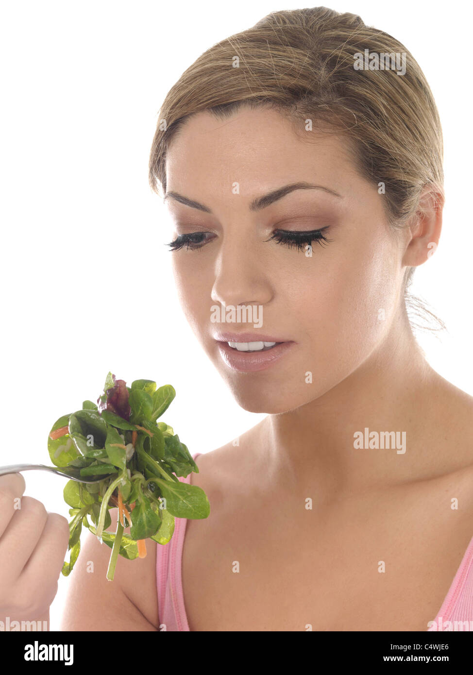 Young Woman Eating Lettuce Leaves. Model Released Stock Photo Alamy