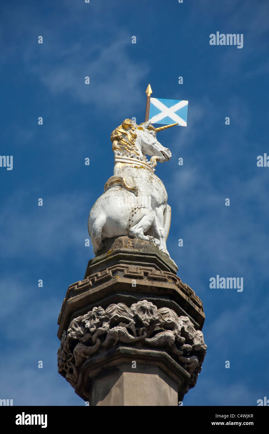 Scotland, Edinburgh, along The Royal Mile. Royal white unicorn atop historic city well. Stock Photo