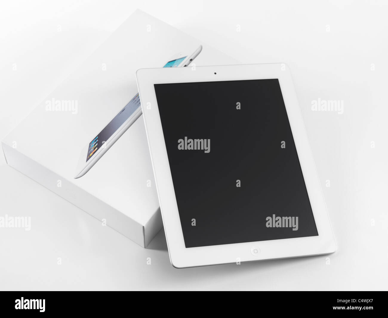 New Apple iPad 2 just out of the box. Isolated on white background. Stock Photo