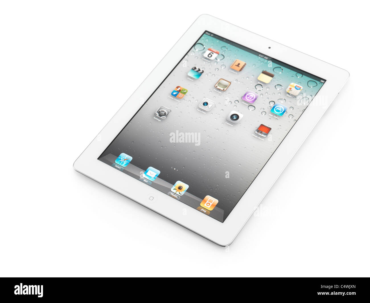 White Apple iPad 2 tablet computer with desktop icons on its display. Isolated with clipping path on white background. Stock Photo