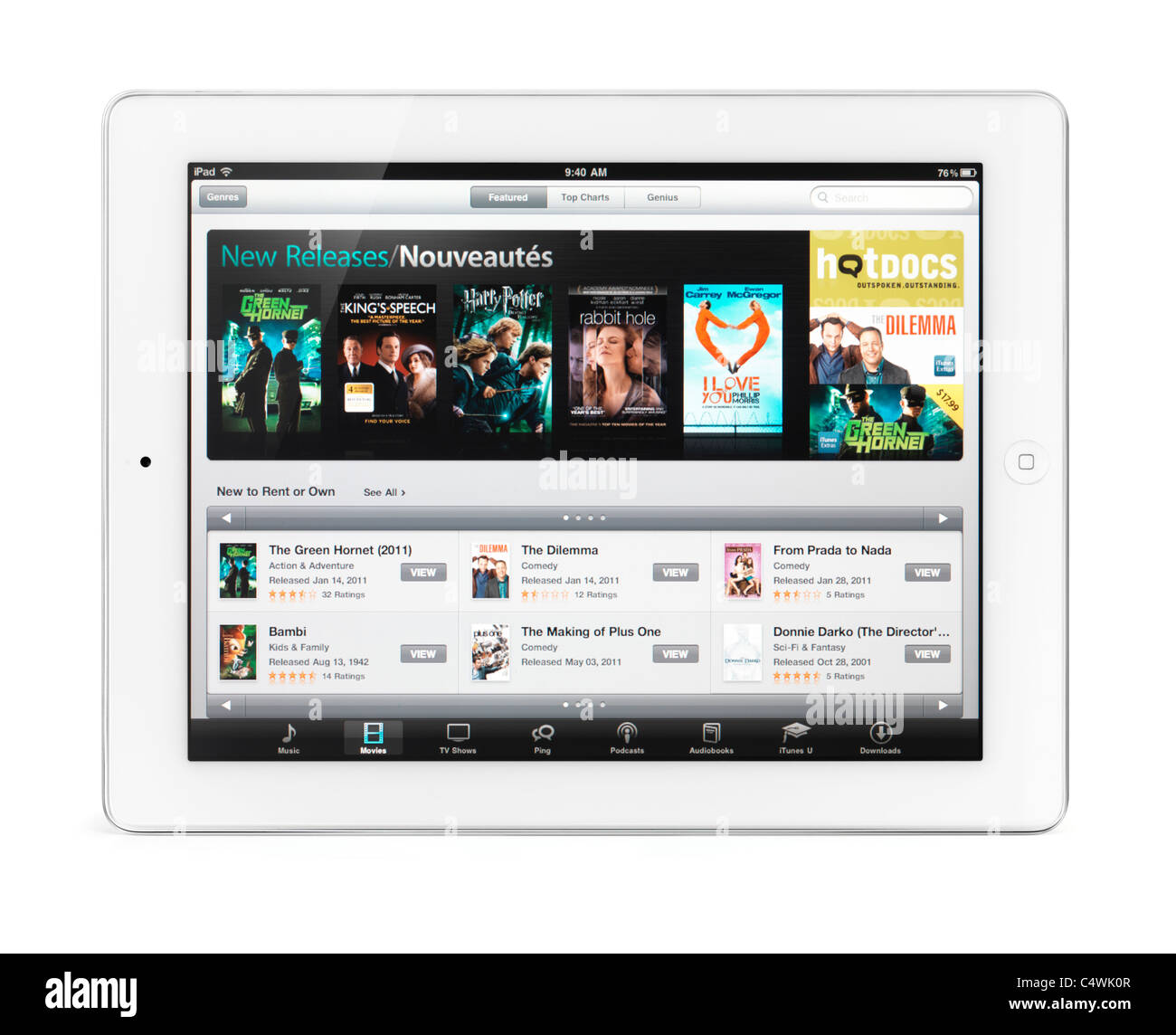 Apple iPad 2 tablet computer with iTunes movies on its display. Isolated with clipping path on white background. Stock Photo