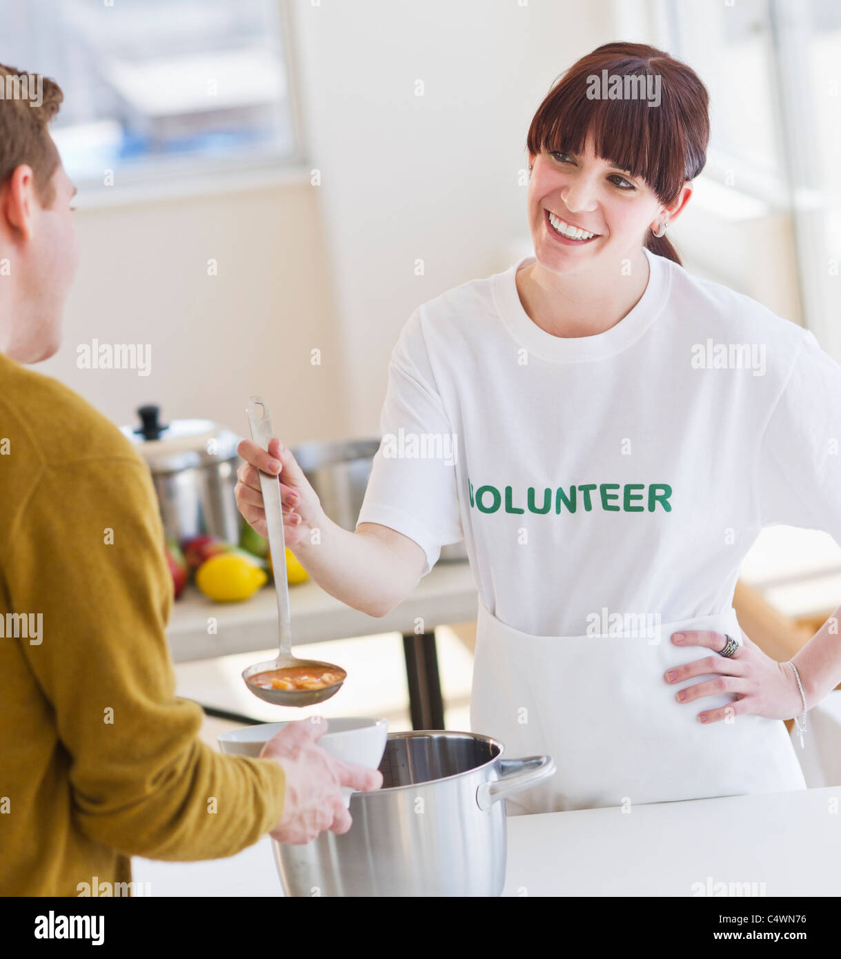 USA,New Jersey,Jersey City,charity volunteer handing out free soup Stock Photo