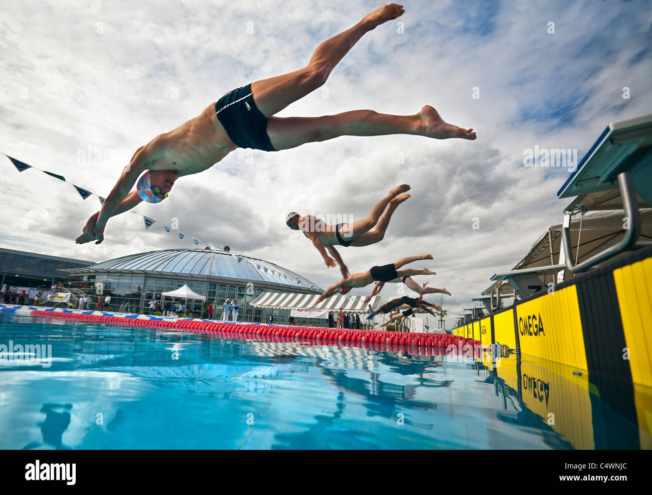 Swimmers making a dive start during their competitive sport (France