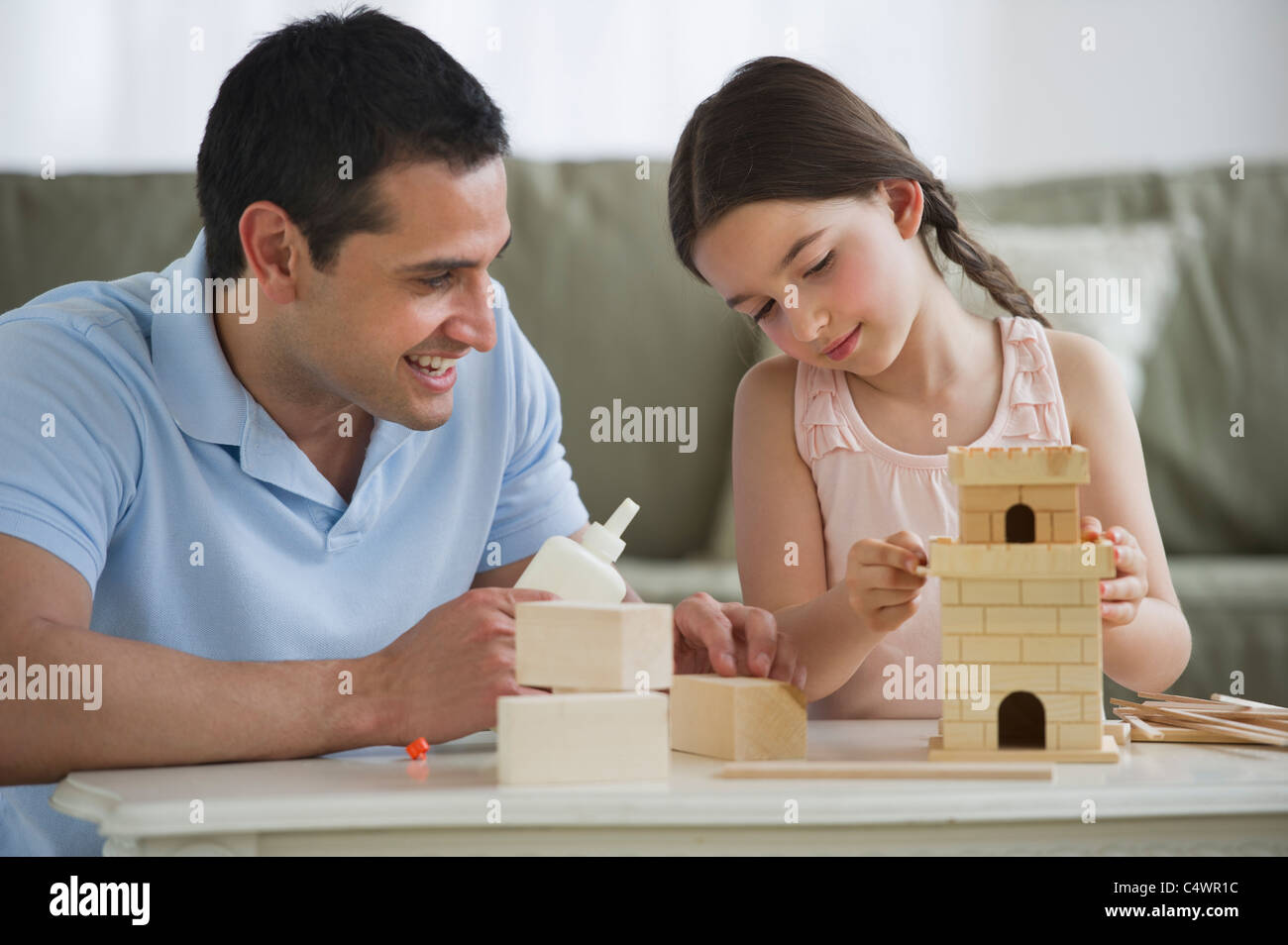 USA,New Jersey,Jersey City,father and daughter (8-9) building toy castle Stock Photo