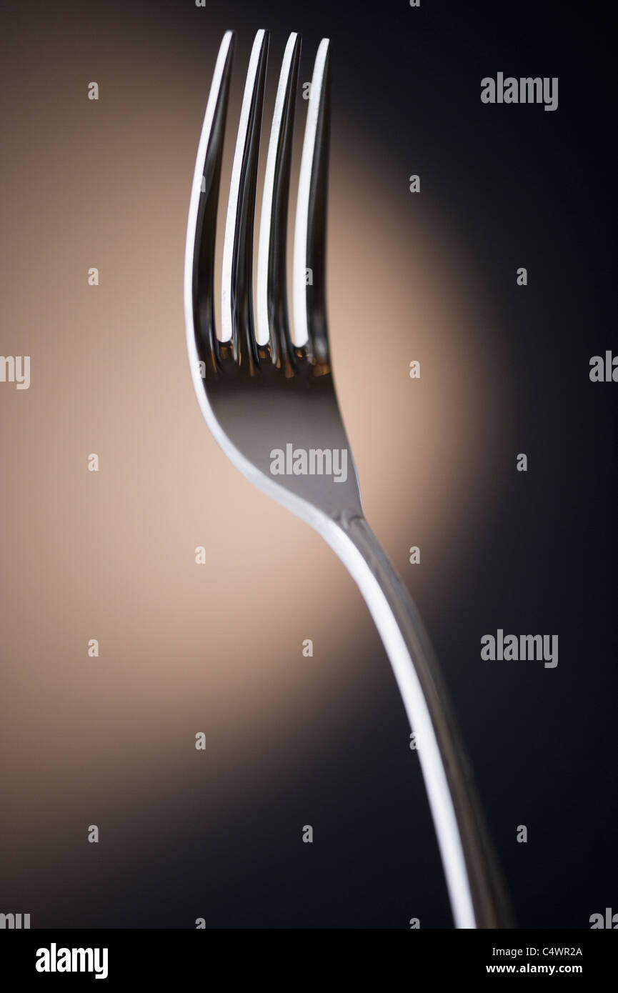 Close up of fork on black background Stock Photo