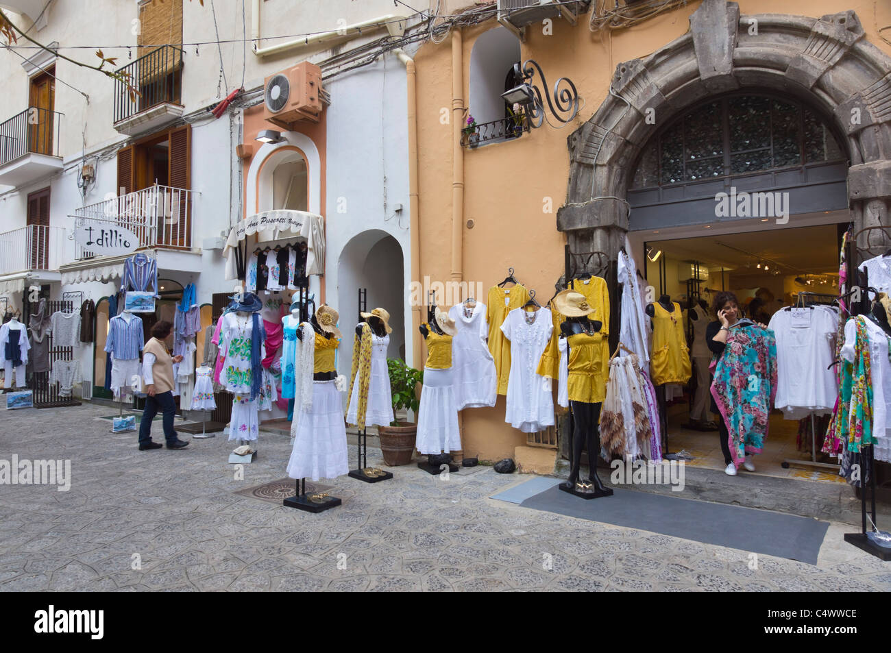 Italy - Positano. Shopping locally made fashion, famous for summer dresses, 'moda Positano' Stock Photo - Alamy