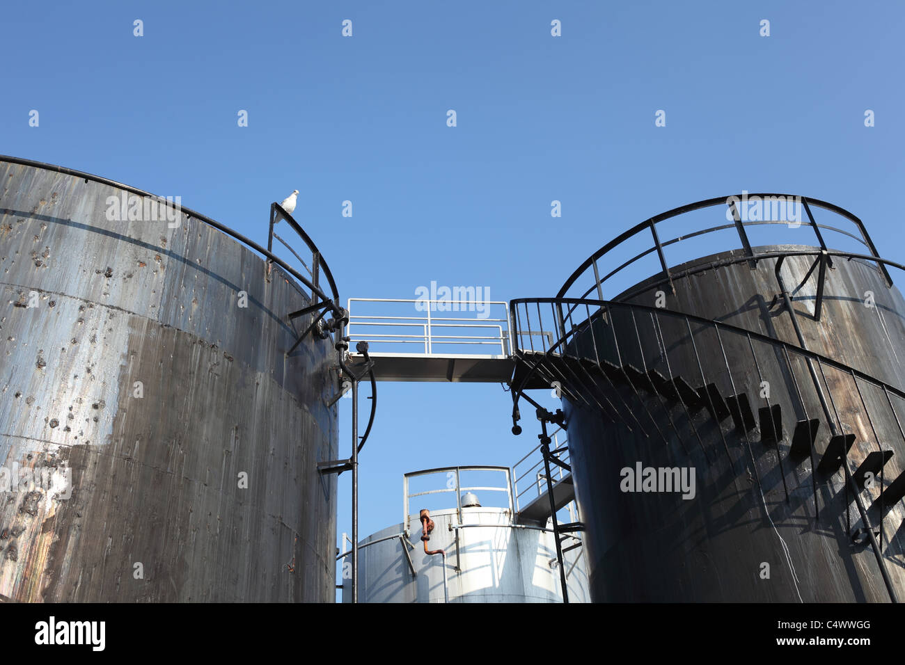 Storage tanks and blue sky Stock Photo - Alamy