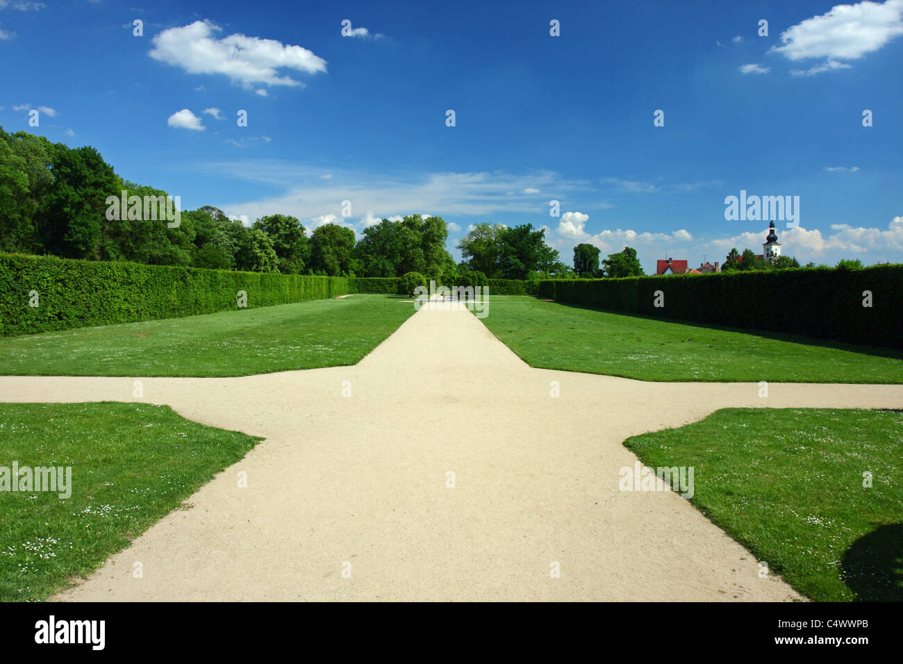 Crossroad in an EnglishFrench garden Stock Photo Alamy