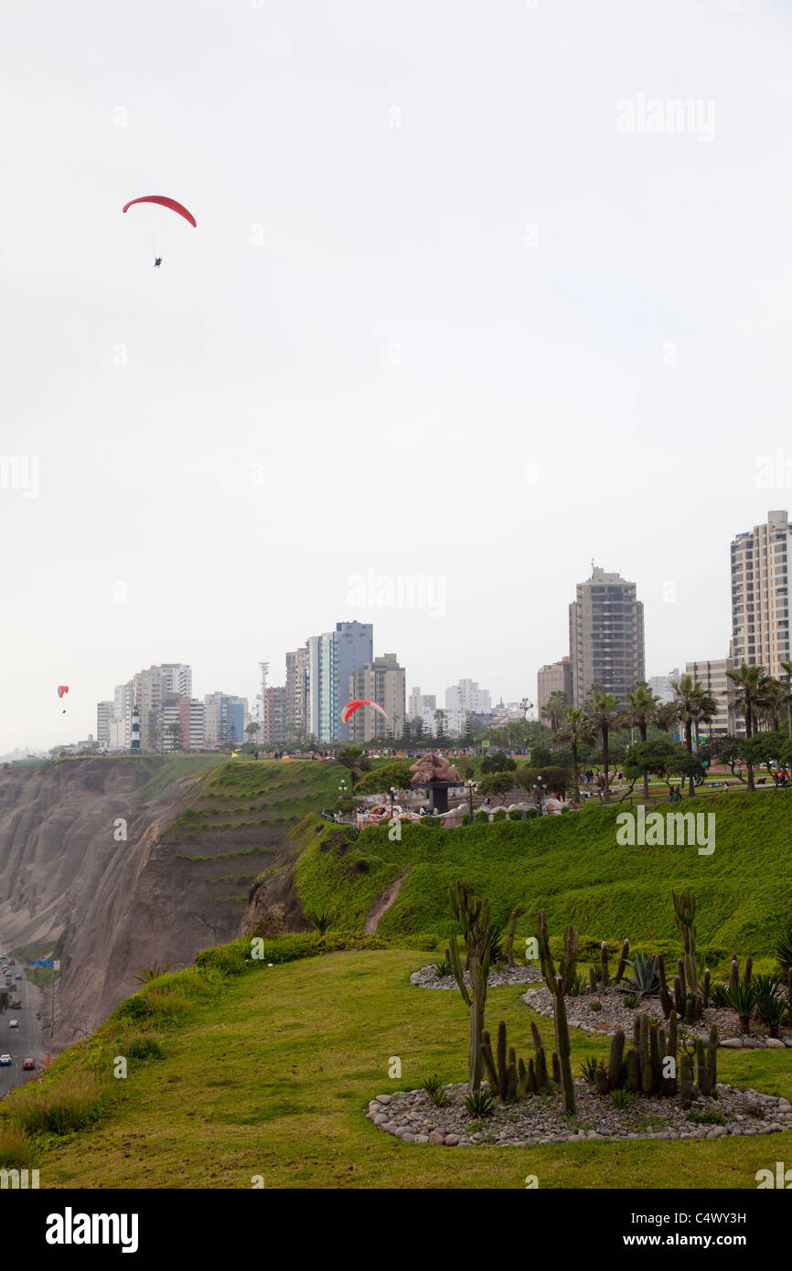 Paragliding over the coastline in Miraflores, Lima, Peru Stock Photo
