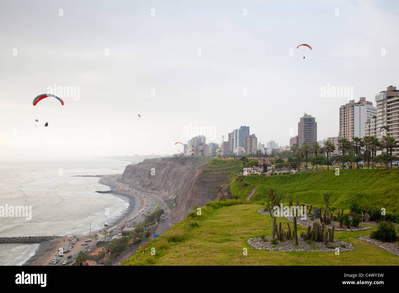 Paragliding over the coastline in Miraflores, Lima, Peru Stock Photo