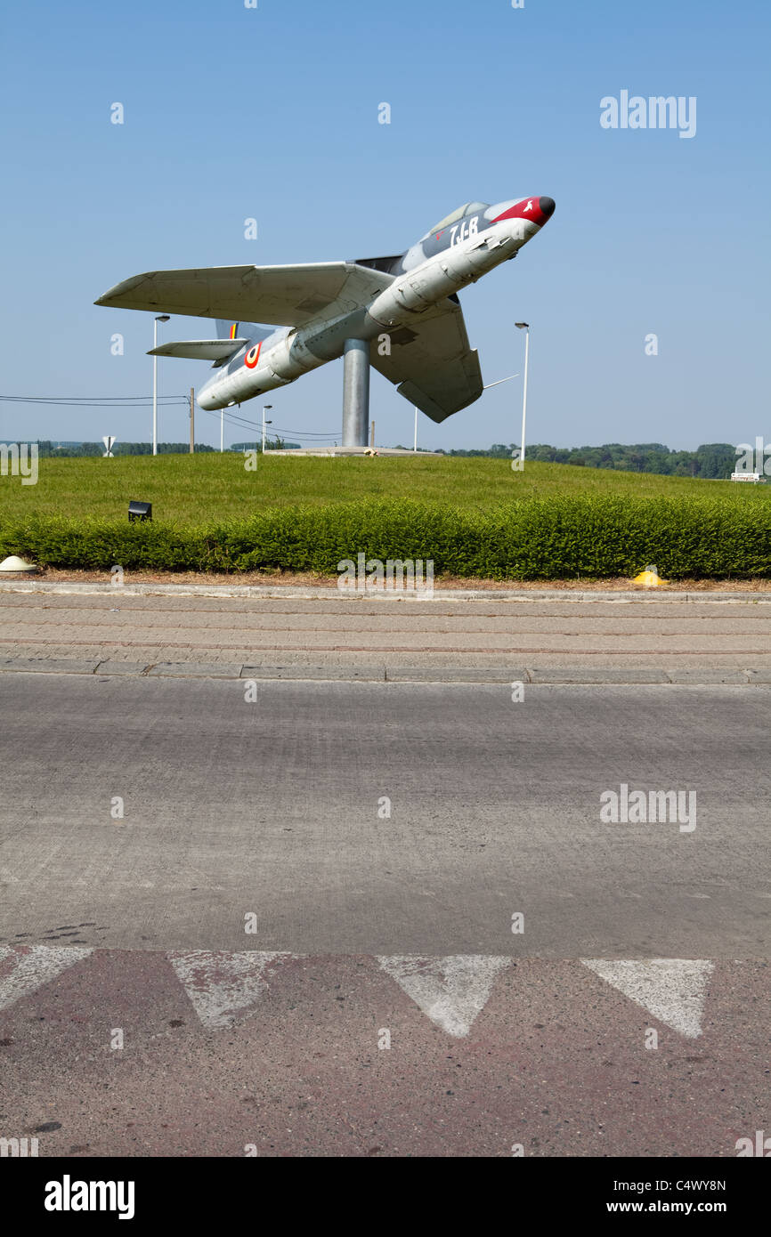 Belgian fighter aircraft from the 1960s put on a roundabout, Chièvres, Hainaut, Wallonia, Belgium, Europe Stock Photo