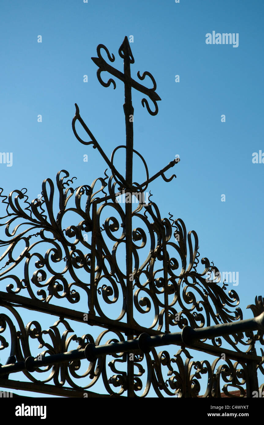 wrought iron cross on the gates of Santiage de Compostela cathedral