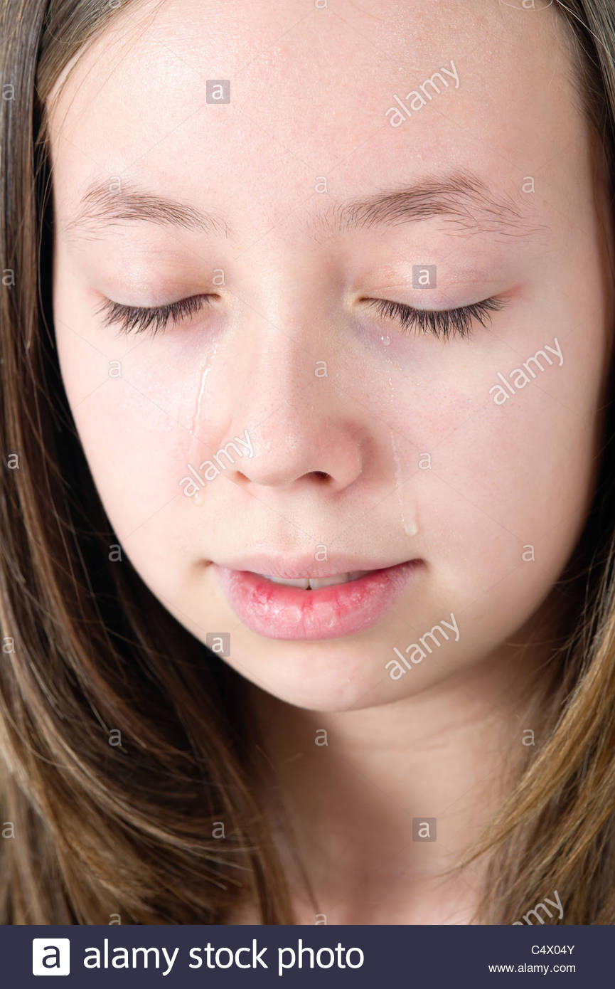 Close Up Of A Young Teen Girl Crying With Eyes Closed Stock Photo