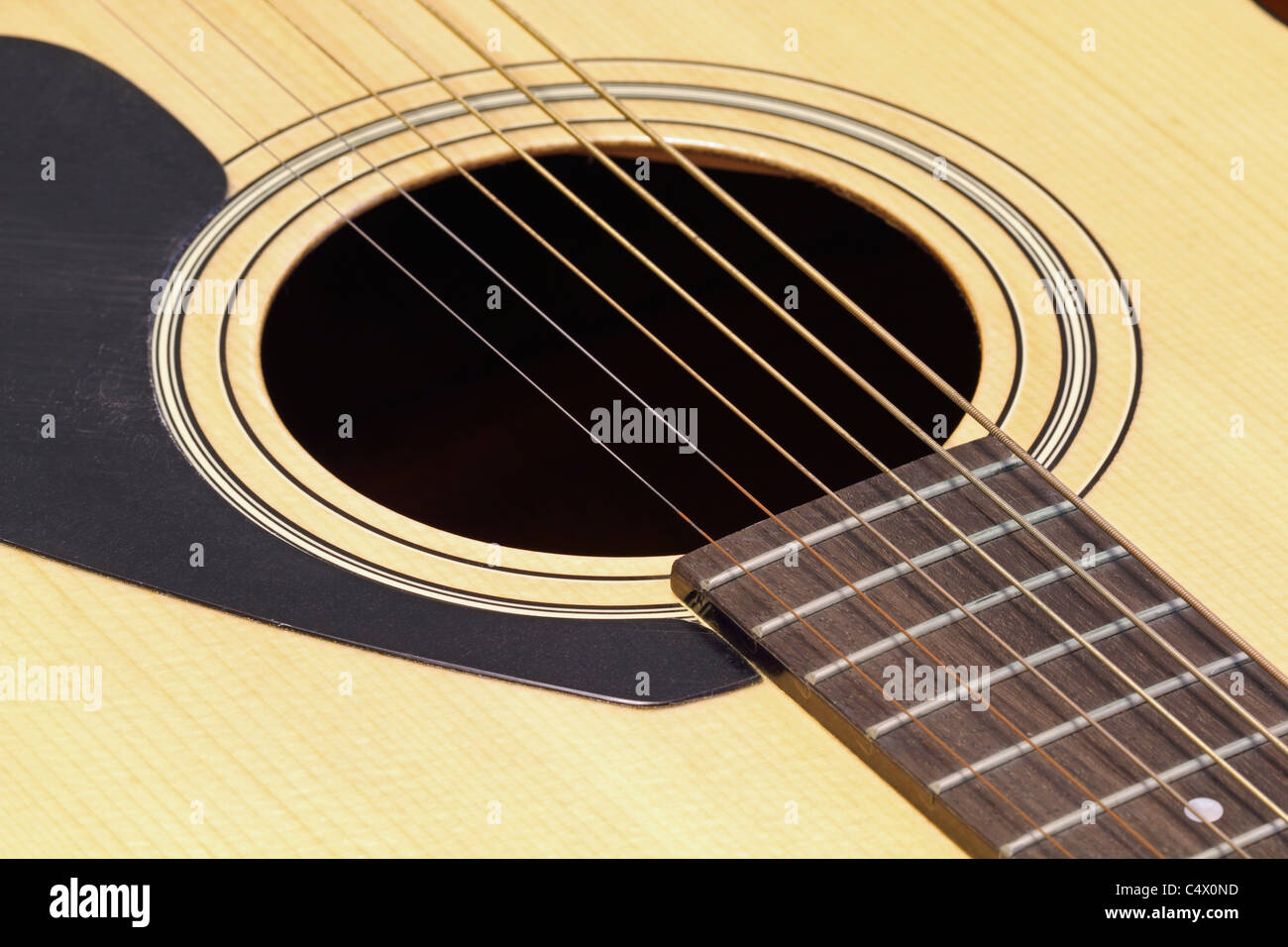 A closeup of the photographer's acoustic guitar . Stock Photo