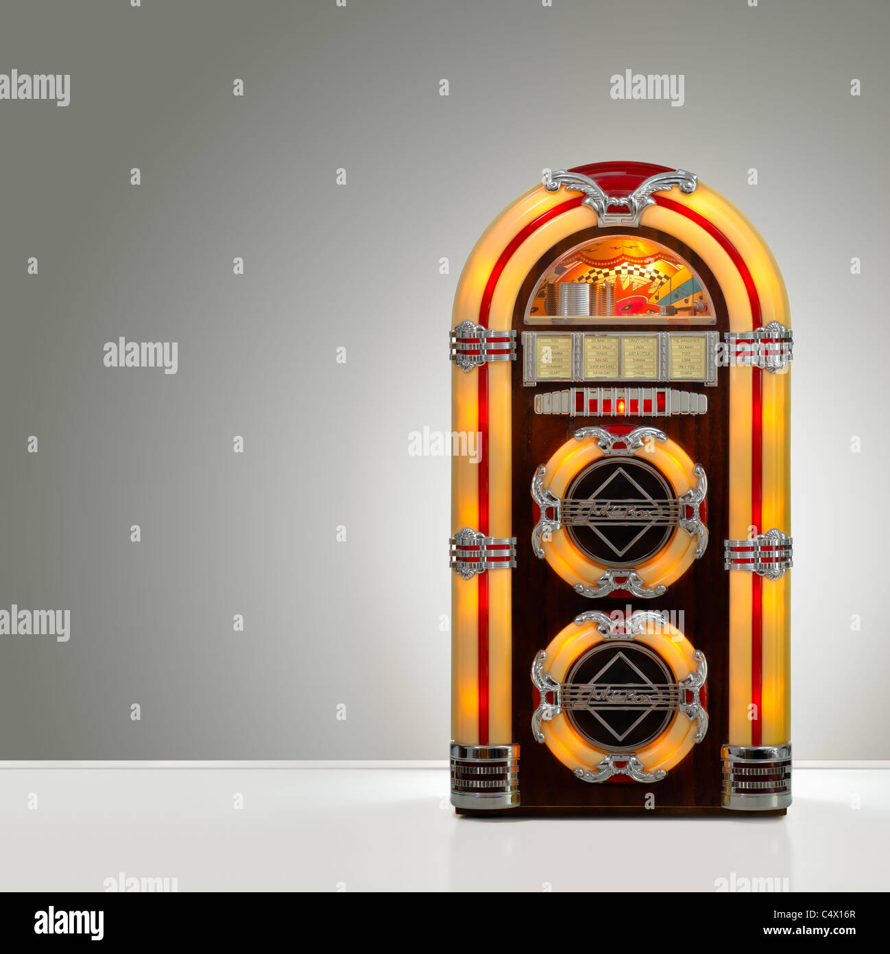 Old retro jukebox in an empty room with nice illumination, copy space ready Stock Photo