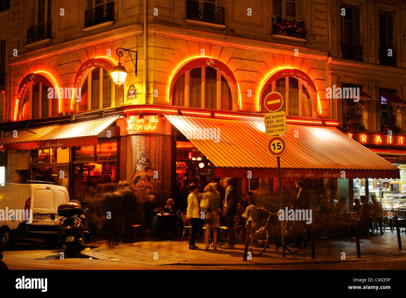 People sitting outside a restaurant in St Germain area of Paris at ...