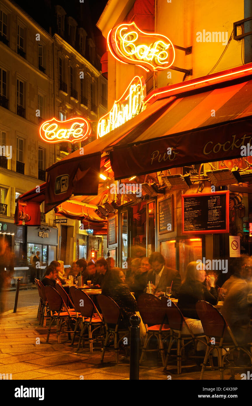 People sitting outside a restaurant in St Germain area of Paris at
