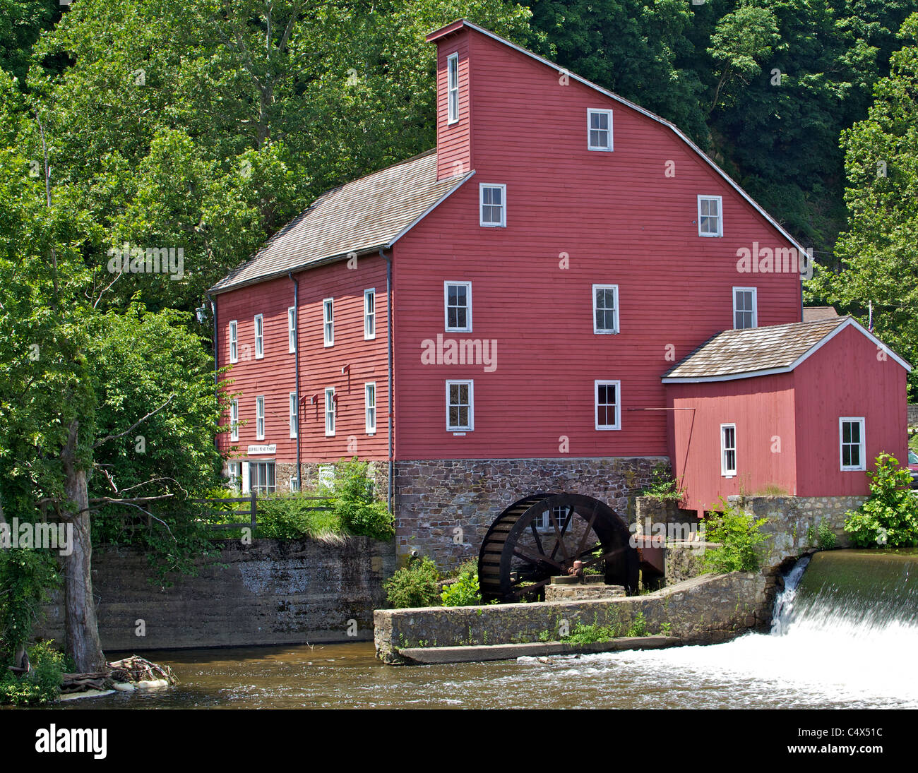 Faded Red Water Mill Stock Photo