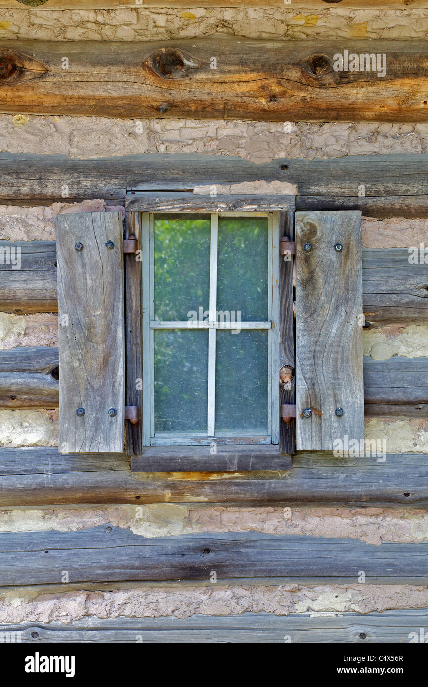 Rustic Window Of A Log Cabin With Handmade Wood Shutters Stock