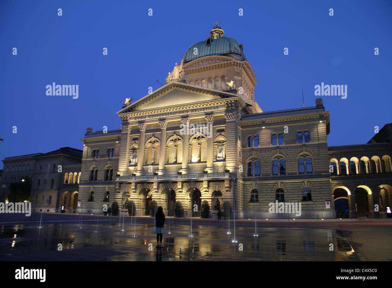 Bern, Florentine-style parliament building, Bundeshaus at dusk @ Bundesplatz with 26 fountains representing every Swiss canton Stock Photo