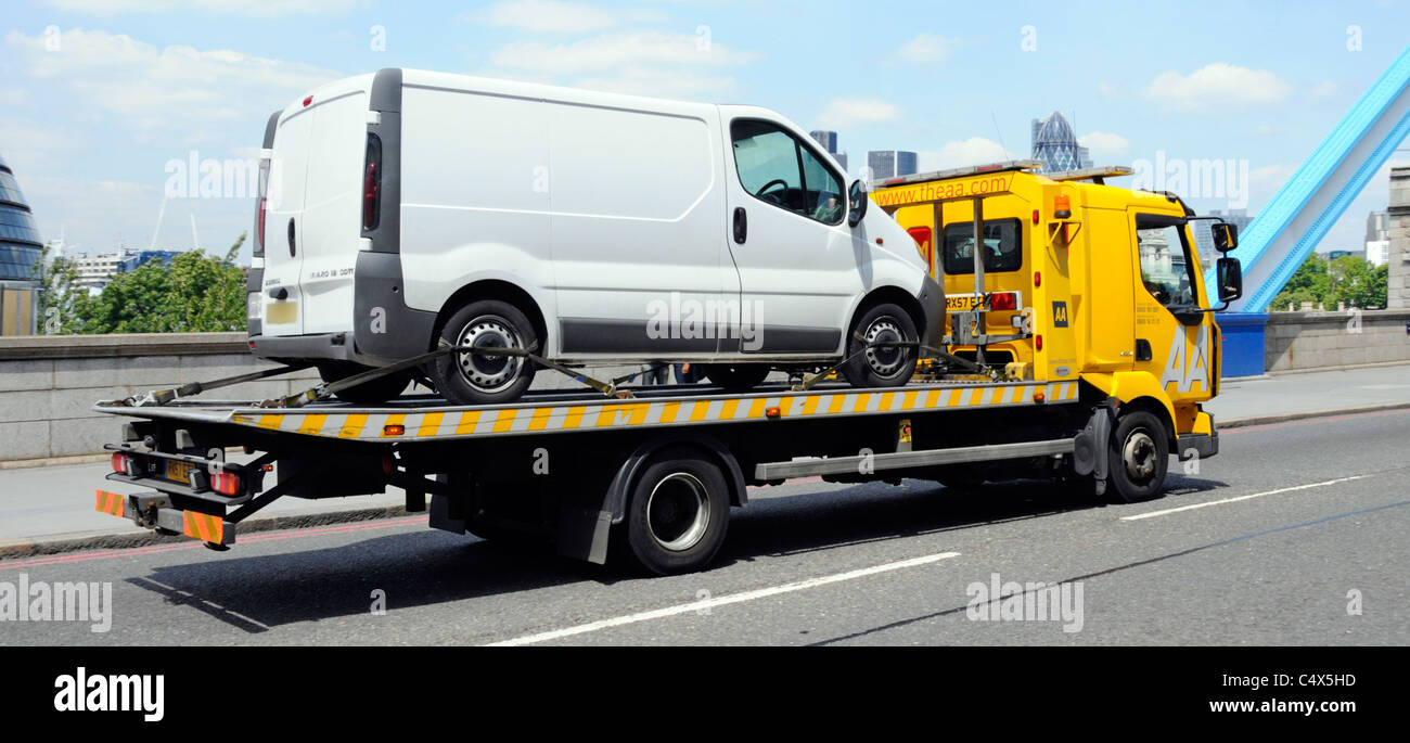 White van loaded onto back of AA breakdown truck Southwark London England UK Stock Photo
