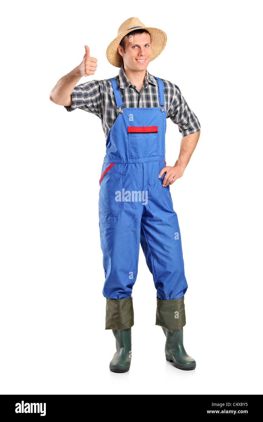 A young smiling farmer giving a thumb up Stock Photo - Alamy