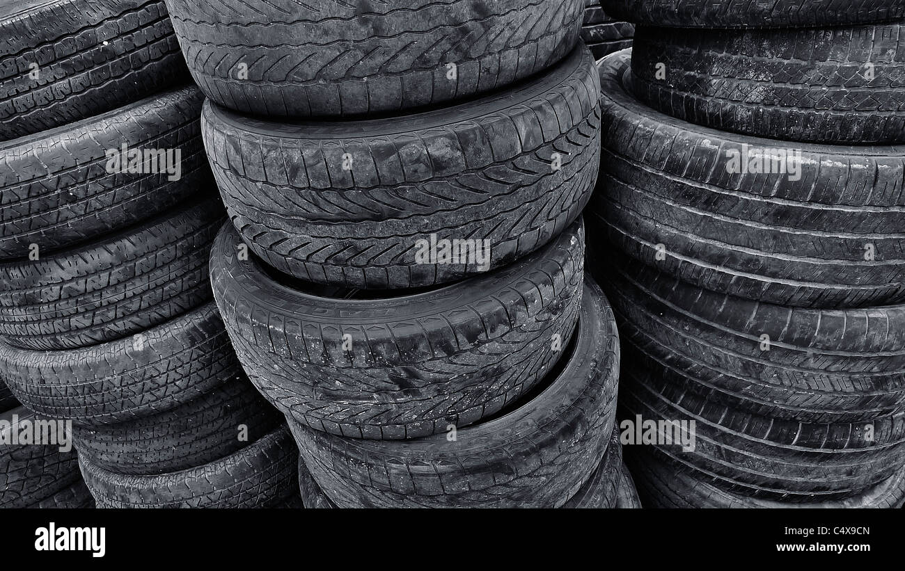 Stacks of old used recycled tires. Stock Photo