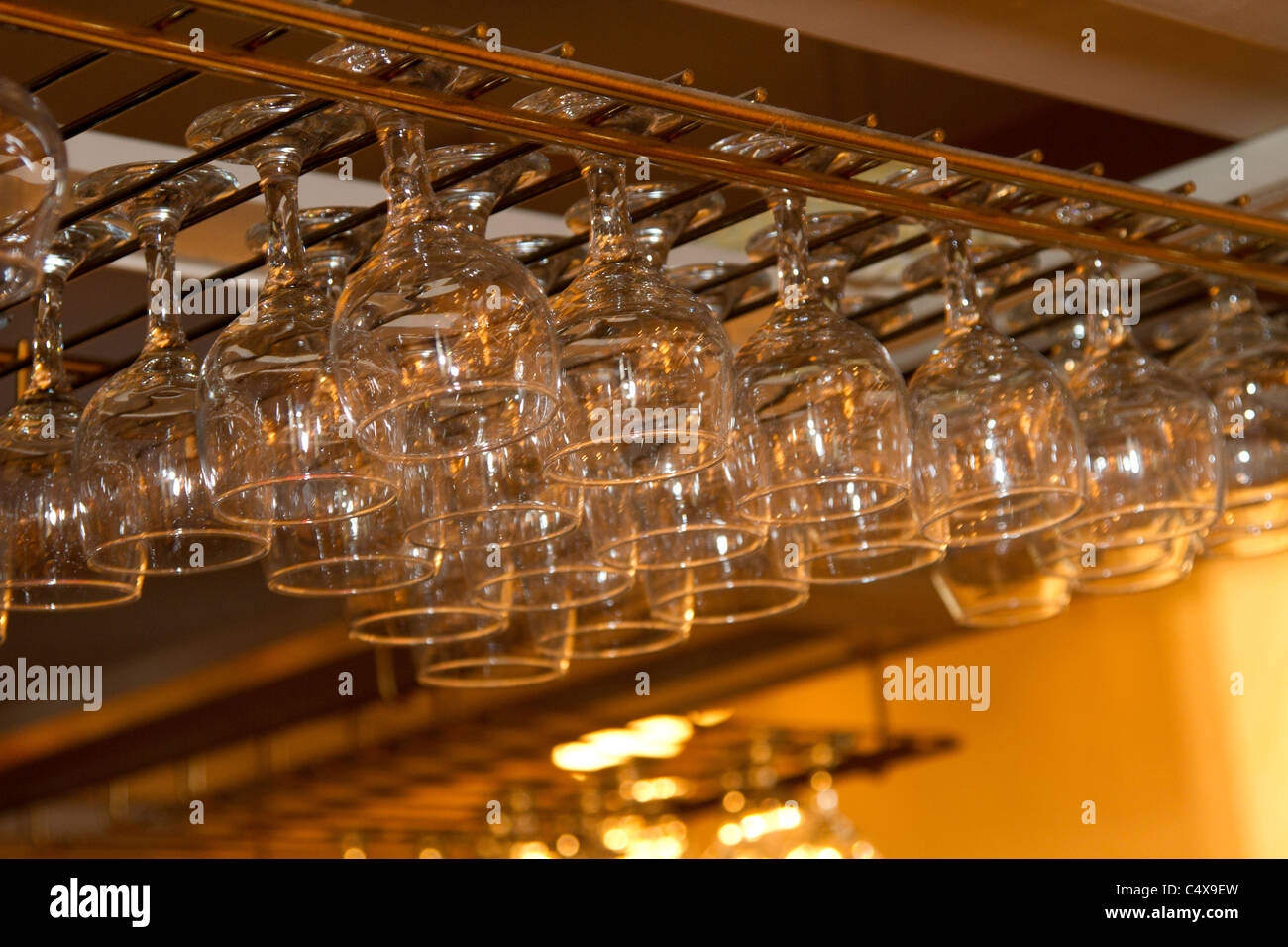 wine glass glasses hanging rack bar Stock Photo Alamy