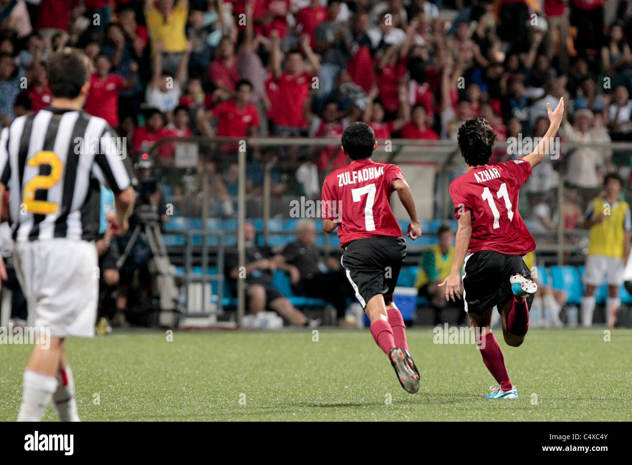 Azhar Ramli(right) and Zulfadhmi Suzliman of Singapore U15 react to Singapore's second goal during the 23rd Canon Lion City Cup Stock Photo