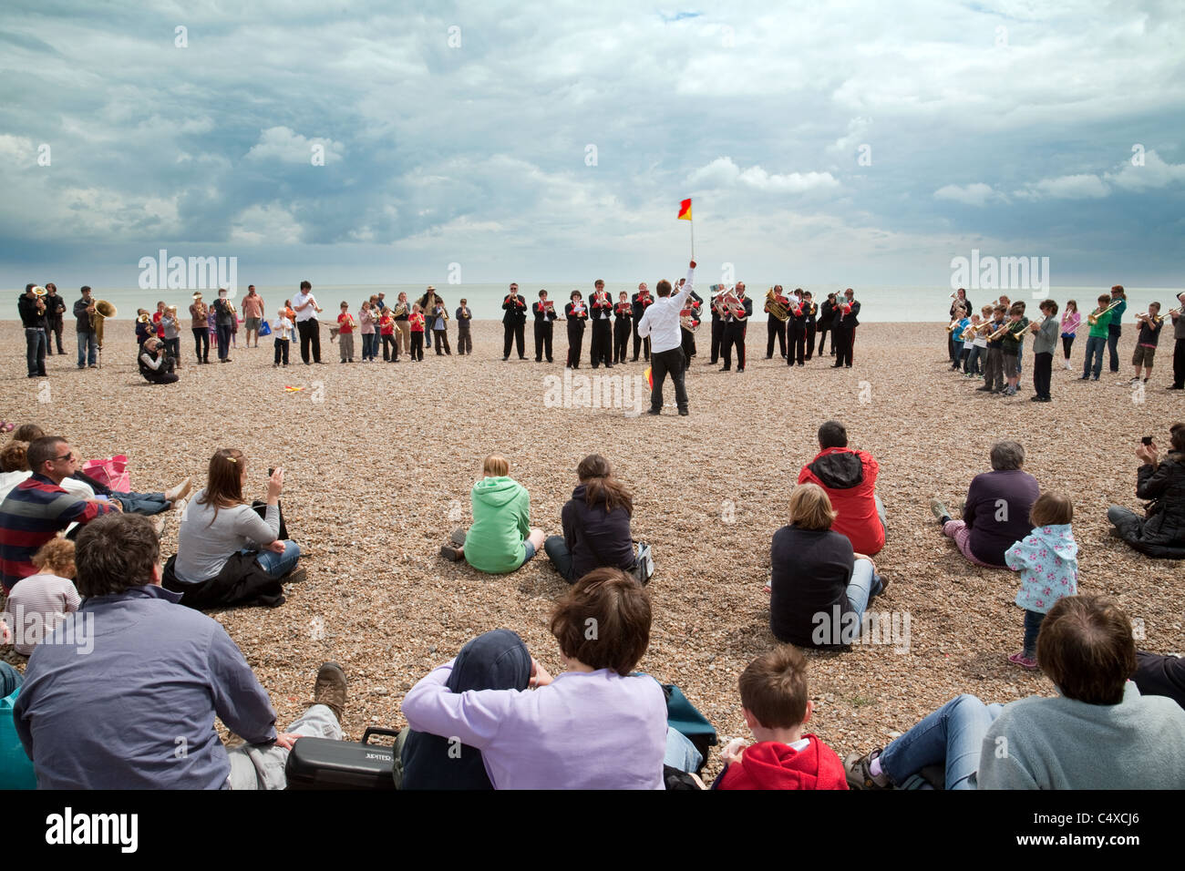 Brass band playing on the Beach during the Aldeburgh Festival, Aldeburgh Suffolk UK Stock Photo