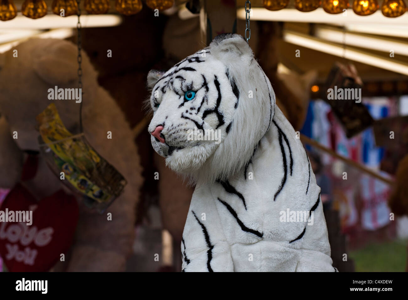 A plush tiger is a prize in a stall at the Hoppings in Newcastle upon Tyne Stock Photo