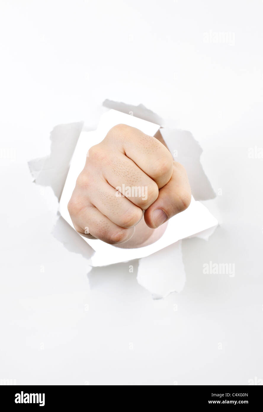 Hand punching through white paper hires stock photography and images Alamy