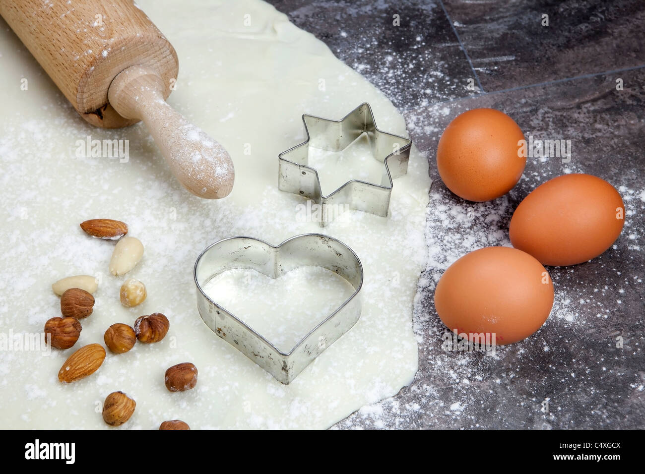 a rolled out dough for biscuits with flour Stock Photo Alamy
