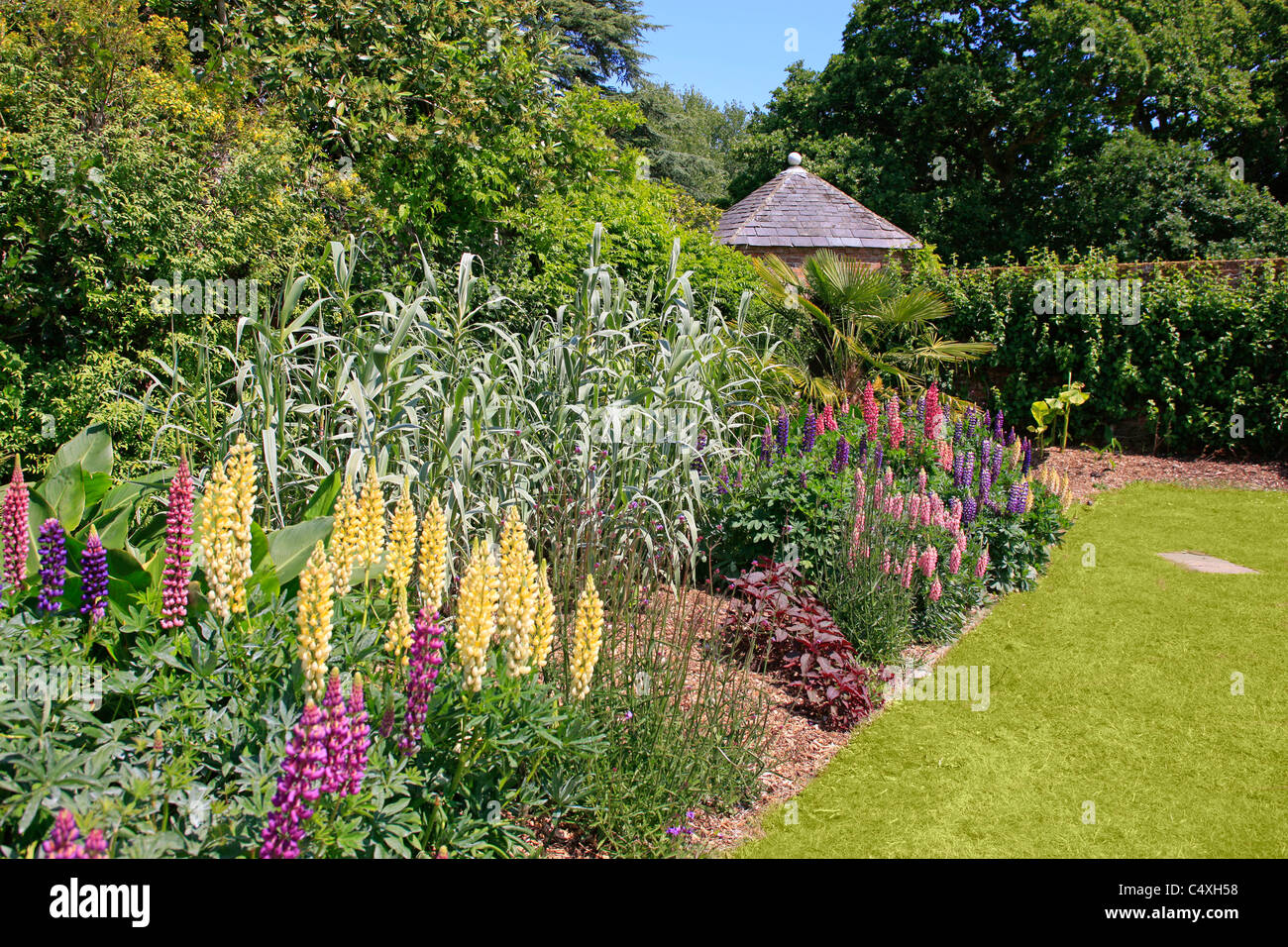 Summer Flowerbeds in an English Walled Garden Stock Photo