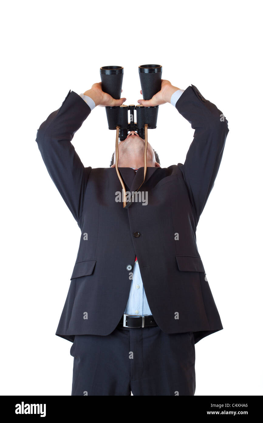 Curious manager turns binoculars up to the sky.Isolated on white background. Stock Photo