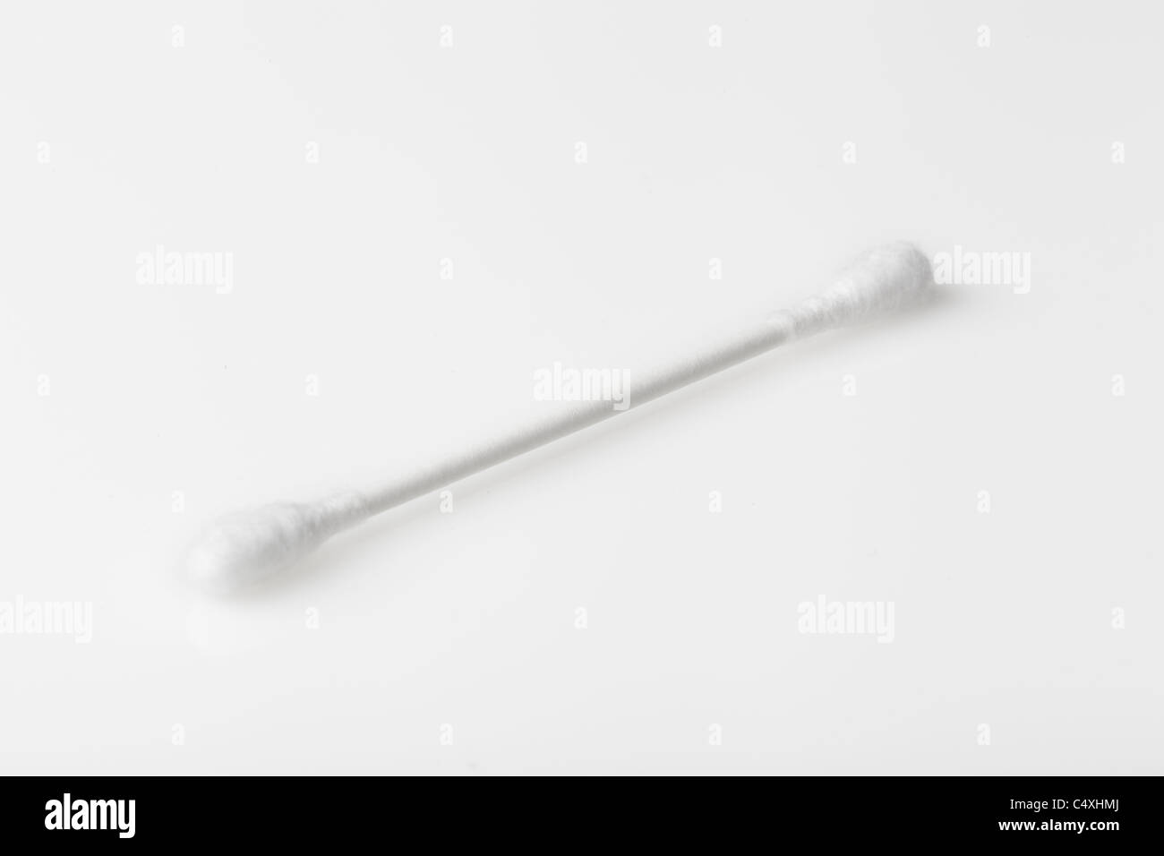 A cotton swab against a white background Stock Photo