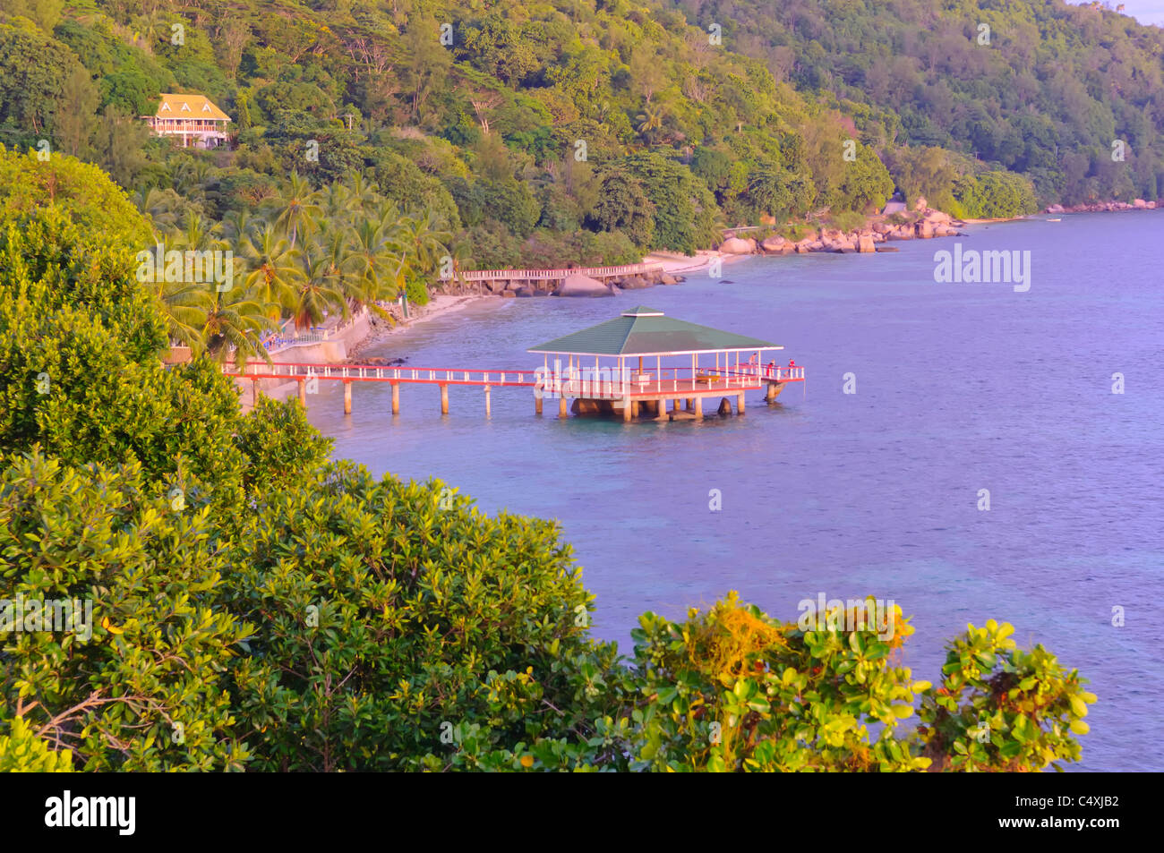 View of jetty from the Black Parrot Suite at the Coco De Mer Hotel Praslin  Island Seychelles Stock Photo - Alamy