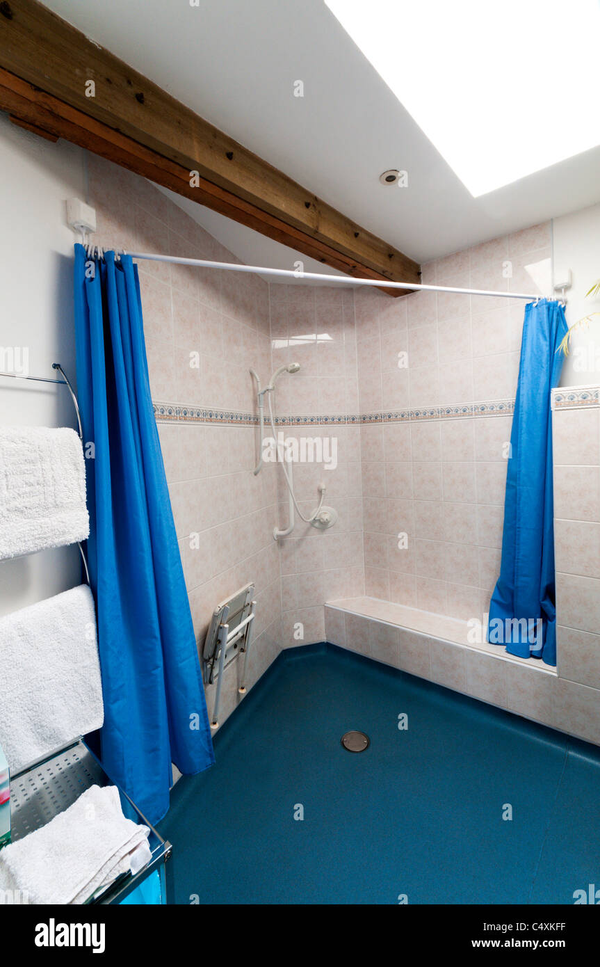 A bathroom in a self-catering holiday cottage adapted for disabled access by a wheelchair user. Stock Photo